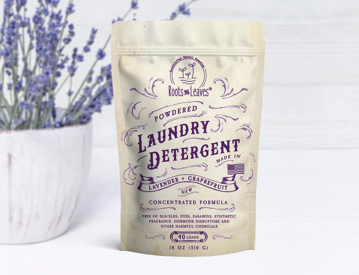 Package of powdered laundry detergent with lavender and grapefruit scent on a white background